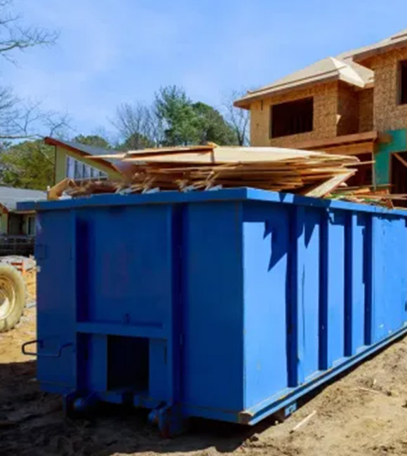 dumpster filled outside of home renovation project